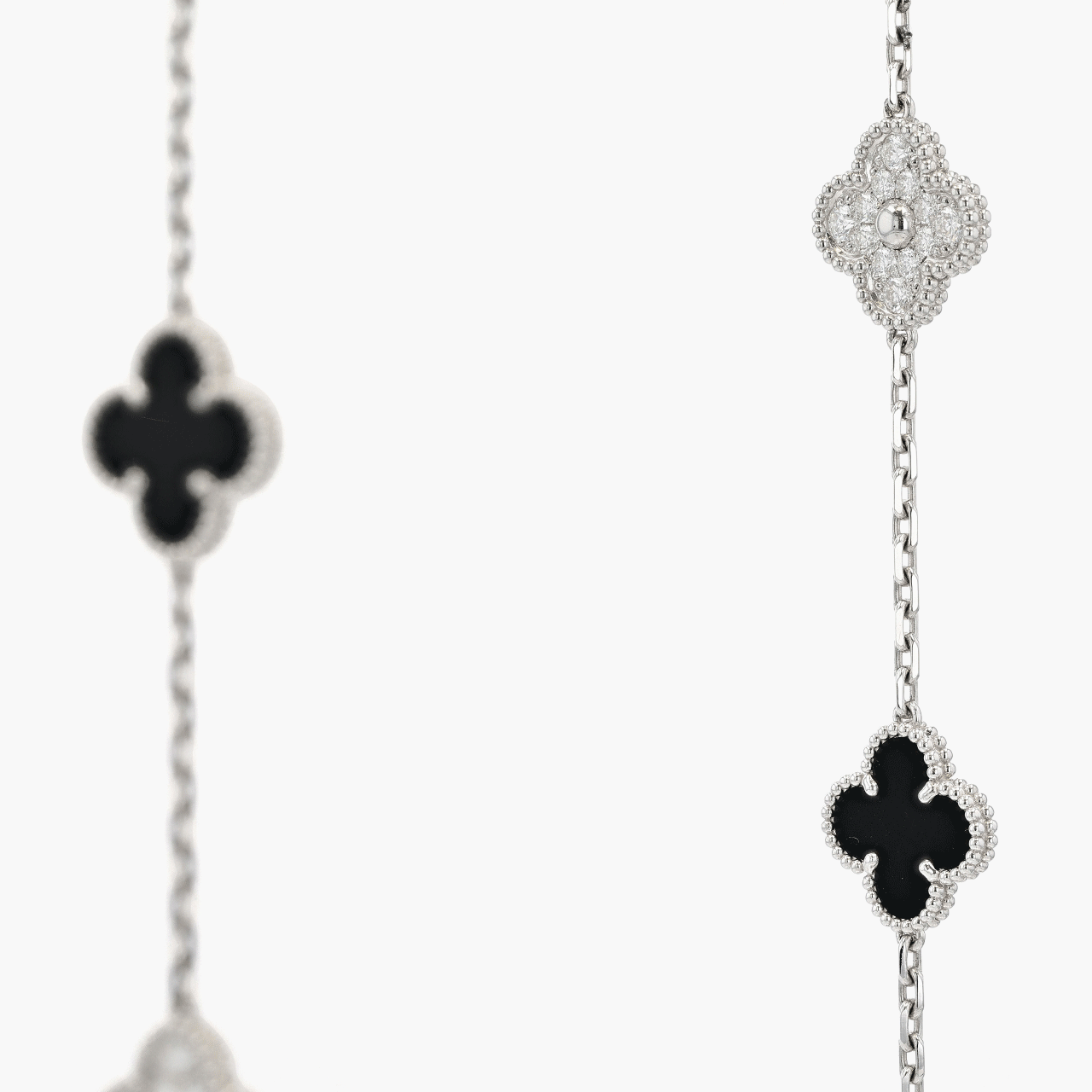 Van Cleef & Arpels White Gold, Diamond, and Onyx Alhambra 20 Motif