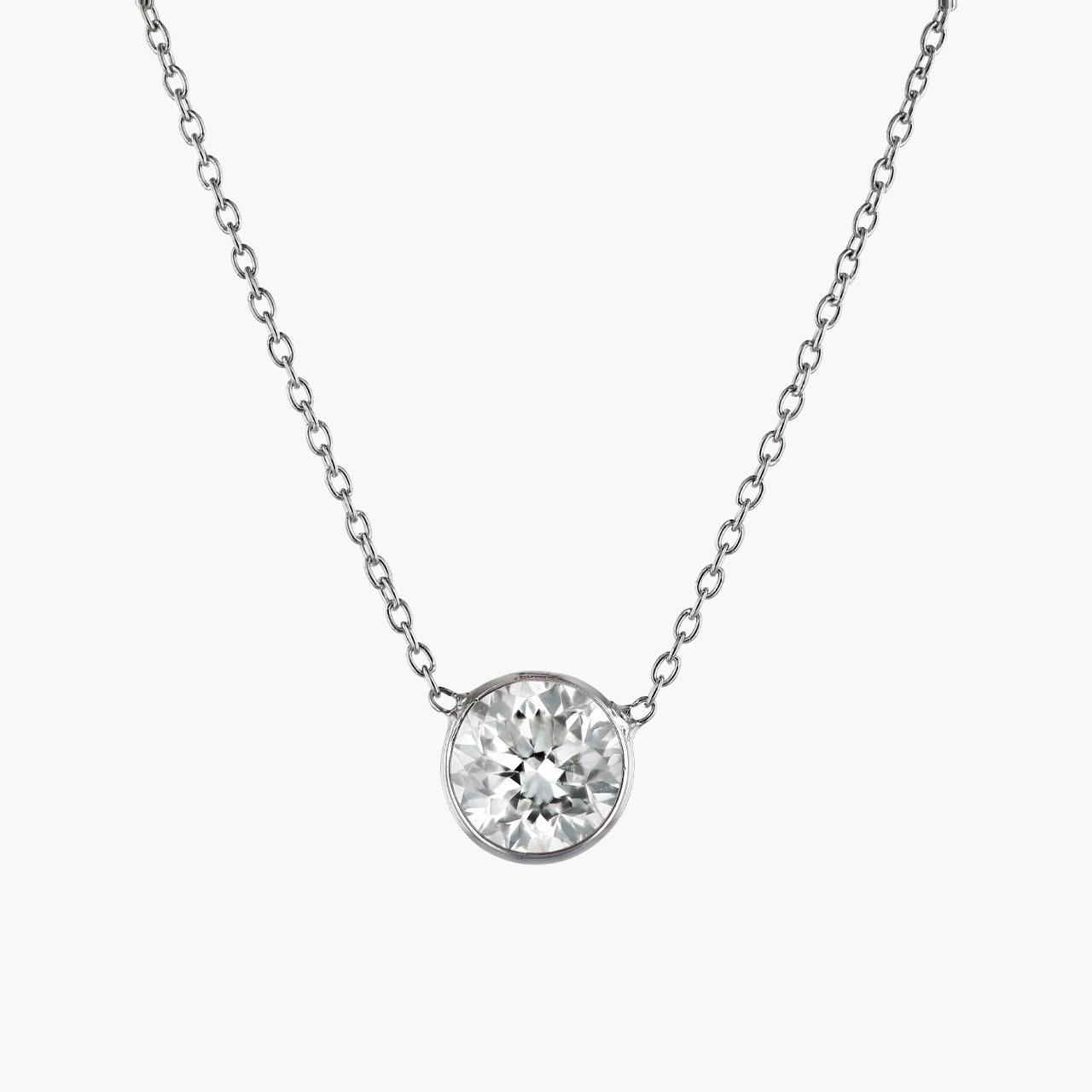 White Gold and Bezel Set Diamond Pendant