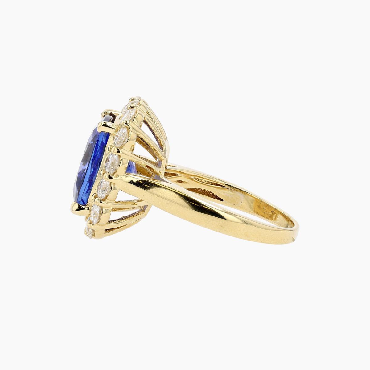 Vintage 18KT Gold Tanzanite and Diamond Halo Ring