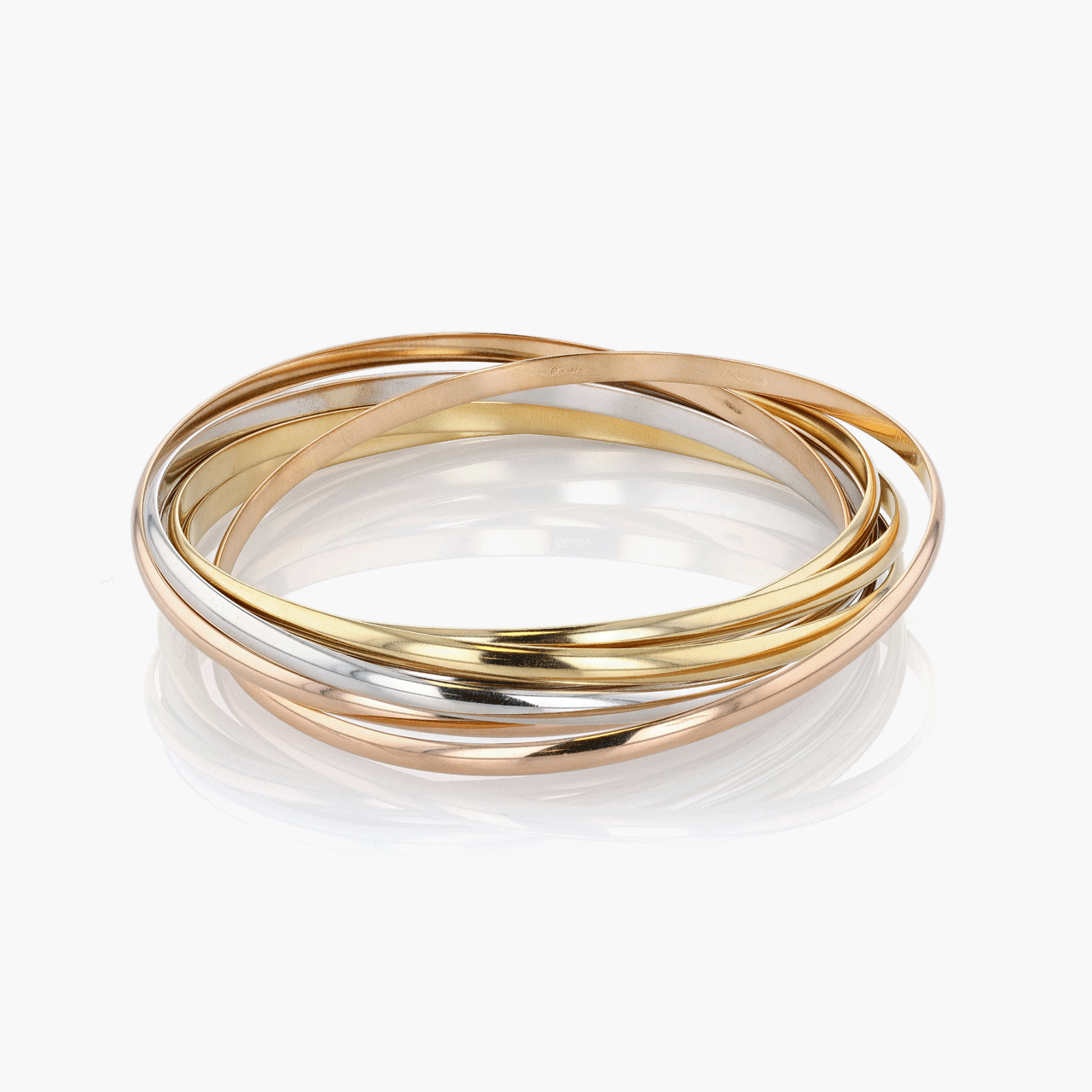 Gold, White Gold, and Rose Gold Seven Row Cartier Trinity Bangle