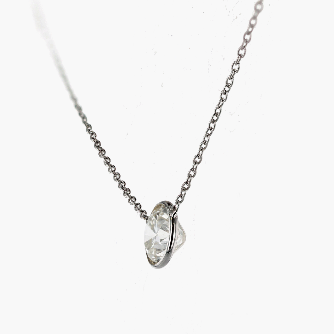 White Gold and Bezel Set Diamond Pendant